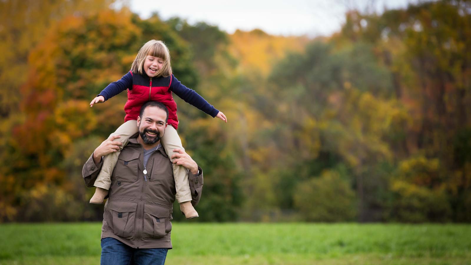 Dad and daughter running at Macdonald farm